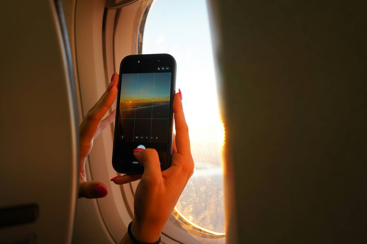 Smartphone showing paused offline mobile game with 'travel agencies on offline' error message during train journey